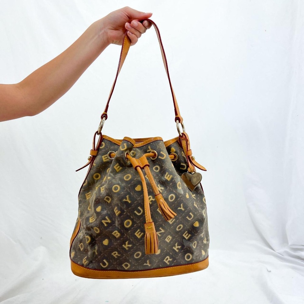 Dooney & Bourke Bucket Shoulder Bag Purse Tote Cinch Heart Charm Tassels